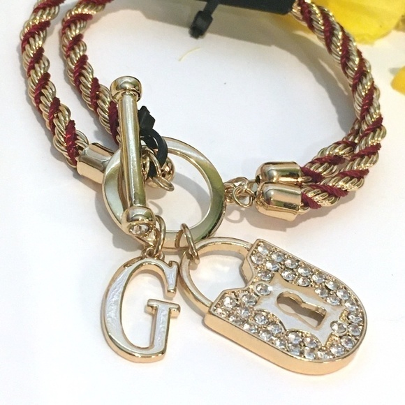 𝅺3/$29! GUESS Twisted Rope Bracelet with Lock - Picture 2 of 9